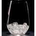 Clear glass filled with cubelet ice cubes on a black background.