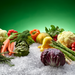 Fresh vegetables displayed on flaked ice from a Hoshizaki F-2001MWJ Flaker Icemaker.