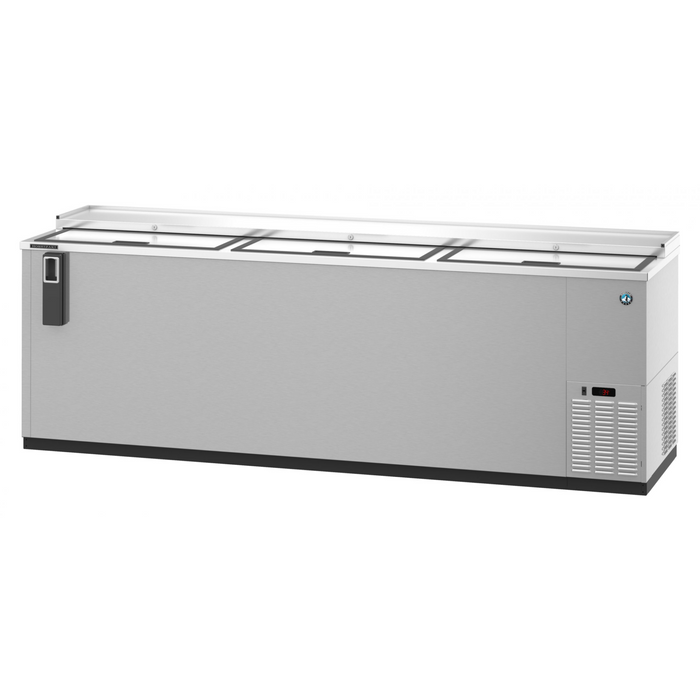 Three-section stainless steel back bar bottle cooler with slide top doors.