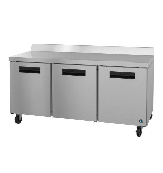 Three-section stainless steel worktop refrigerator with doors.